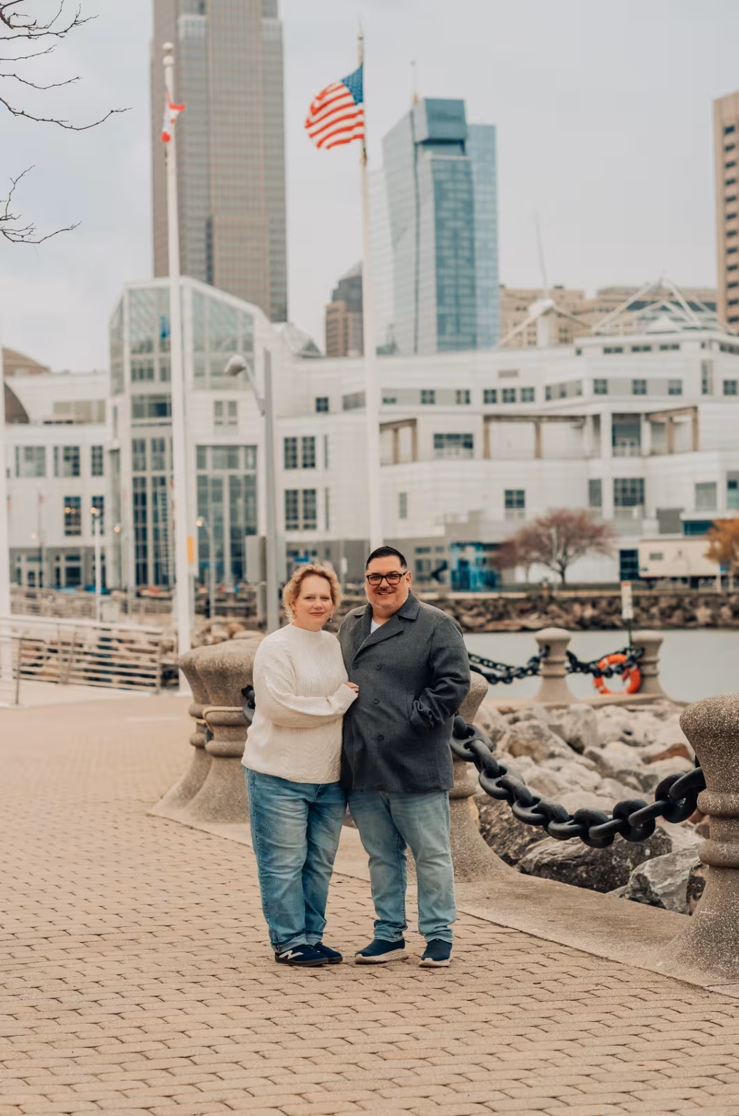 Bishop and Heather Whetstone beneath the American flag in Cleveland