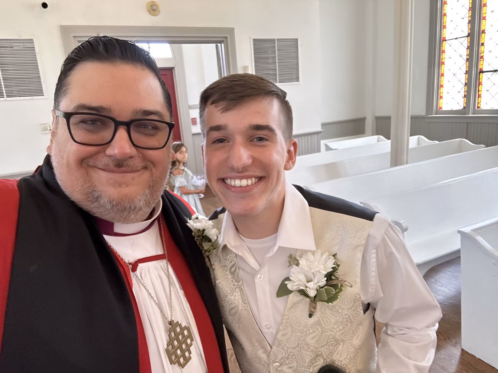 Bishop Whetstone with his wife at the altar